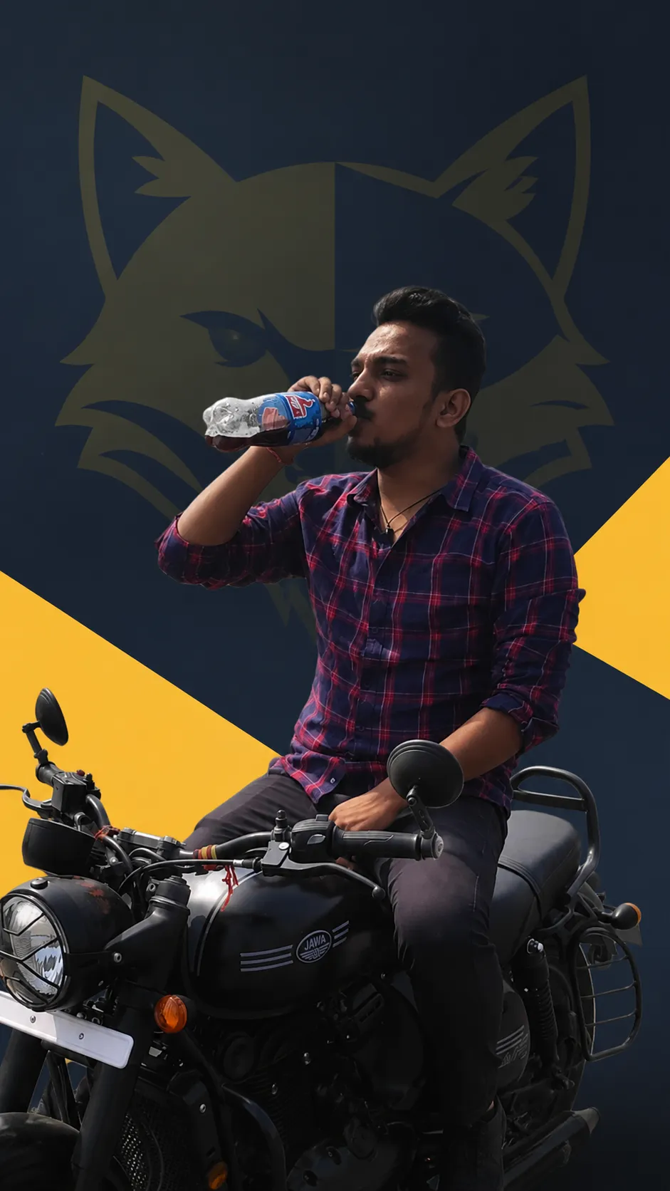Shreyansh sitting on a motorcycle in front of The Solid Billa mural